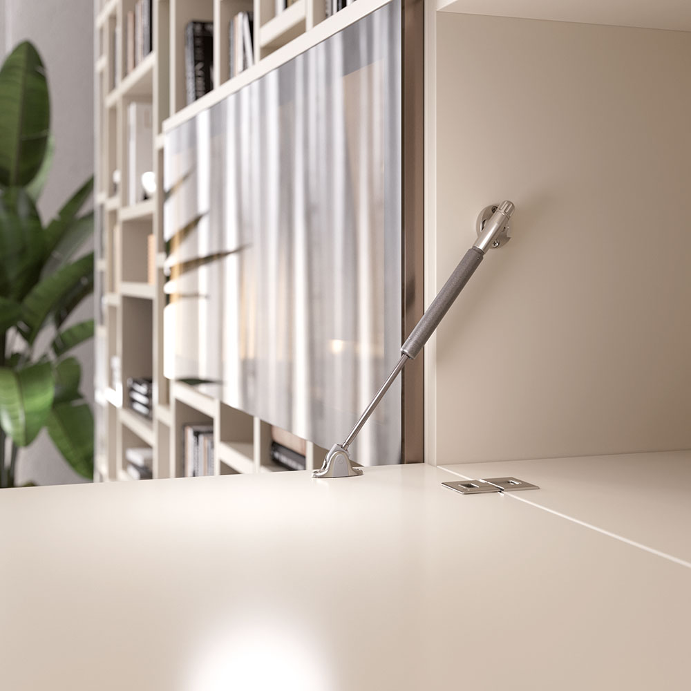 Lowered flap with a Kraby drop-down gas spring installed, bookshelf and plant in the background